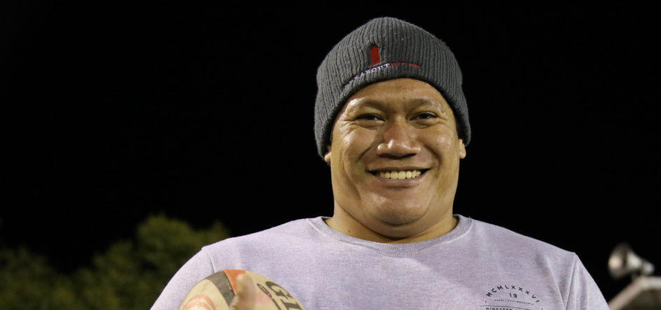 Samoan worker playing football in Cowra