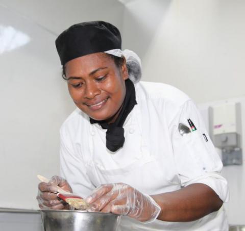 Pacific worker preparing food