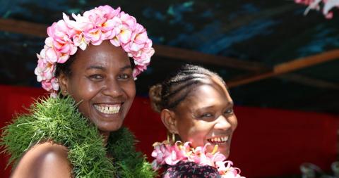 Solomon Islands women wearing decorative flower garlands