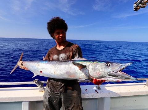 A fisheries worker from Tuvalu with his catch